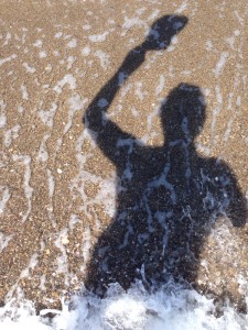 The Idiot dances in the surf after reach 9,000-km on his MedTrek.