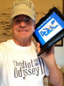 Giveaways include "The Idiot and the Odyssey II" cap, shirt and iBook.