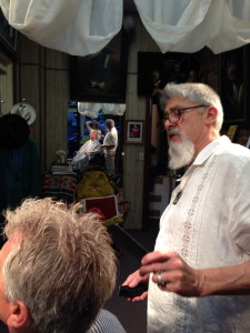 Mike surveys an Idiot-ic head as he cuts my hair.