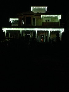 The beauty of simple icicle-shaped eXmas lights on a Victorian mansion at 5 a.m.