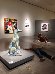 The Idiot becomes part of the "Good Dog!" exhibit by playing dead.