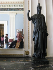Mirror image next to a statuette of Athena in Corfu.