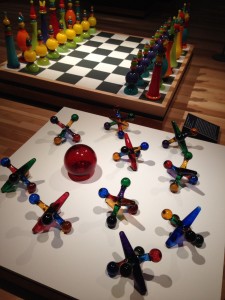 Gigantic jumping jacks flash at the "Supercool Glass" exhibit in Shelburne, VT.