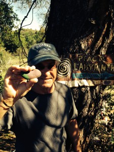 The Idiot delivers a painted stone to the Peace Labyrinth. (Photo: Leslie Williams Schwerdt)