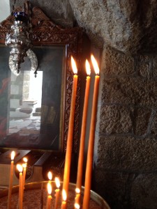 Lighting candles and meditating in the grotto sanctuary where St. John is said to have received his visions from Christ (Revelation 1: 9-10).