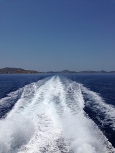 Patmos begins to fade in the wake of the high-speed cat.