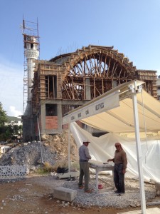 A mosque quickly rises.