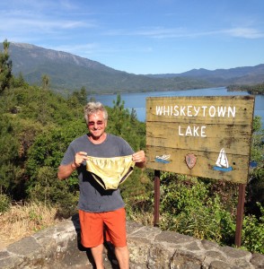 The Idiot shows some visiting Swiss motorcyclists his gold suit before training in Whiskeytown Lake.
