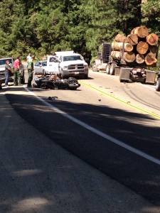A female motorcyclist collides with a logging truck near the top of Buckhorn Summit. 