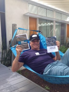 The Idiot promotes his MedTrekking books while lazing on a hammock made from recycled seat belts from Jaguar cars. (Photo: Liz Chapin) 