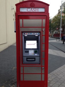 Many of London's iconic red phone boxes are now ATM cash machines.
