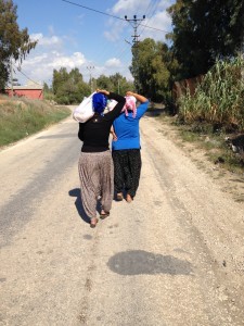Following two women carrying lamb to be cooked for a Sacrificial Feast during the four-day Kurban Bayrami holiday in Bebeli, Turkey.
