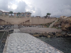 Locals are outraged that the Russian owner of this seaside mansion bribed someone in the TRNC government to permit him to move rocks (upper right) and illegally block the steps to the beach in front of his home. 
