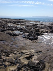 A peaceful and easy to walk lava beach near Agia Marina.