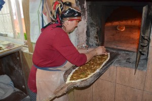 The Idiot is taught how to cook "Turkish pizza" at the Dilara restaurant in Dipkarpaz.