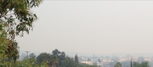 Wildfire-produced smoke obscures Redding at mid-morning on August 10.