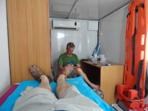 After giving me first aid on the beach, The Idiot got me to medics who patched the wounds from my fall on sharp rocks.