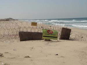 A not-too-serious fence on a beach in Israel on the MedTrek towards Gaza. (Photo: Michael Knipe)