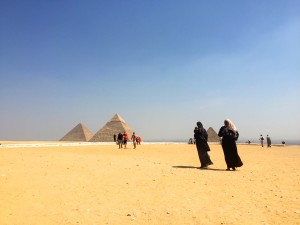 Tourists of all nationalities flock to the Giza Pyramids.