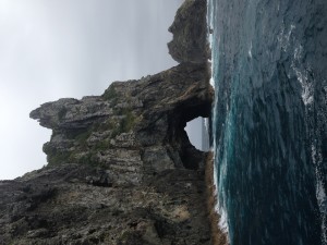 Waves and wind made it a little tricky for The Idiot to sail through the Hole in the Rock on Motu Kōkako, one of the 144 islands in the Bay of Islands in northern New Zealand.