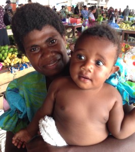 One of the first things a baby learns at the Port Vila market is the difference between a papaya, a kiwi, a banana and a pineapple.