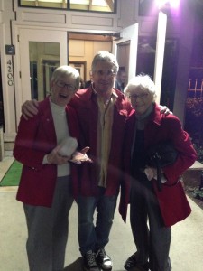 The Idiot is caught dining with women wearing the chic red coats that are the rage in California this month. (Photo: Liz Chapin)