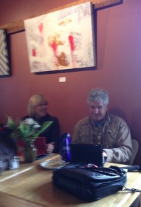 An industrious young man took this iPhoto of The Idiot and Liz Chapin catching up (they have no-wi-if at their squat on the Pacific Ocean) at the Beachcomber Cafe and emailed it to them. (Photo: Lennon)