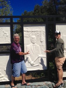The Idiot and his son Luke spend a few minutes at the Kennedy Memorial Plaque west of Redding, CA, to brief President John F. Kennedy on the current US presidential race. The Idiot was at the Whiskeytown Dam on September 28, 1963, when JFK gave the dedication speech. (Photo: Liz Chapin) 