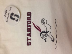 The Idiot wears a vintage T featuring a diving/swimming Indian, the name and mascot of Stanford's sports teams until 1972 when it  was deemed offensive and changed to Cardinal.