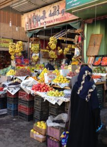 An Egyptian woman buying fruit in Luxor.