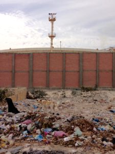 Worst: Walls and garbage blocking a MedTrekker from entering a power plant on the seaside.