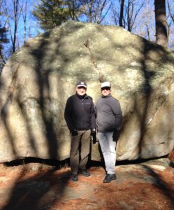Idiot follower Phil Avery leads The Idiot on a delightful hike through the 824-acre Whitney and Thayer Woods nature reserve and forest in Cohasset, MA.  Thinking climate change This solitary boulder is a vestige of the last ice age. (Photo: Liz Chapin)