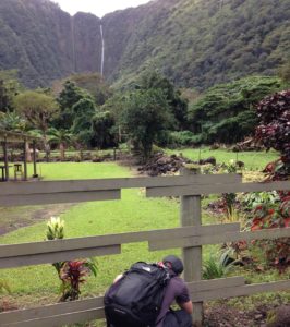 The Idiot's son Luke photographs a waterfall at the back of the Waipi'o Valley.